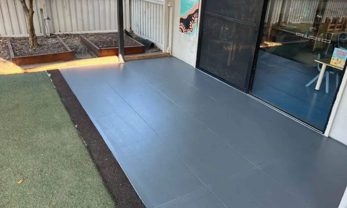 Rebuilt elevated verandah with a new grey tiled floor, Booval childcare centre