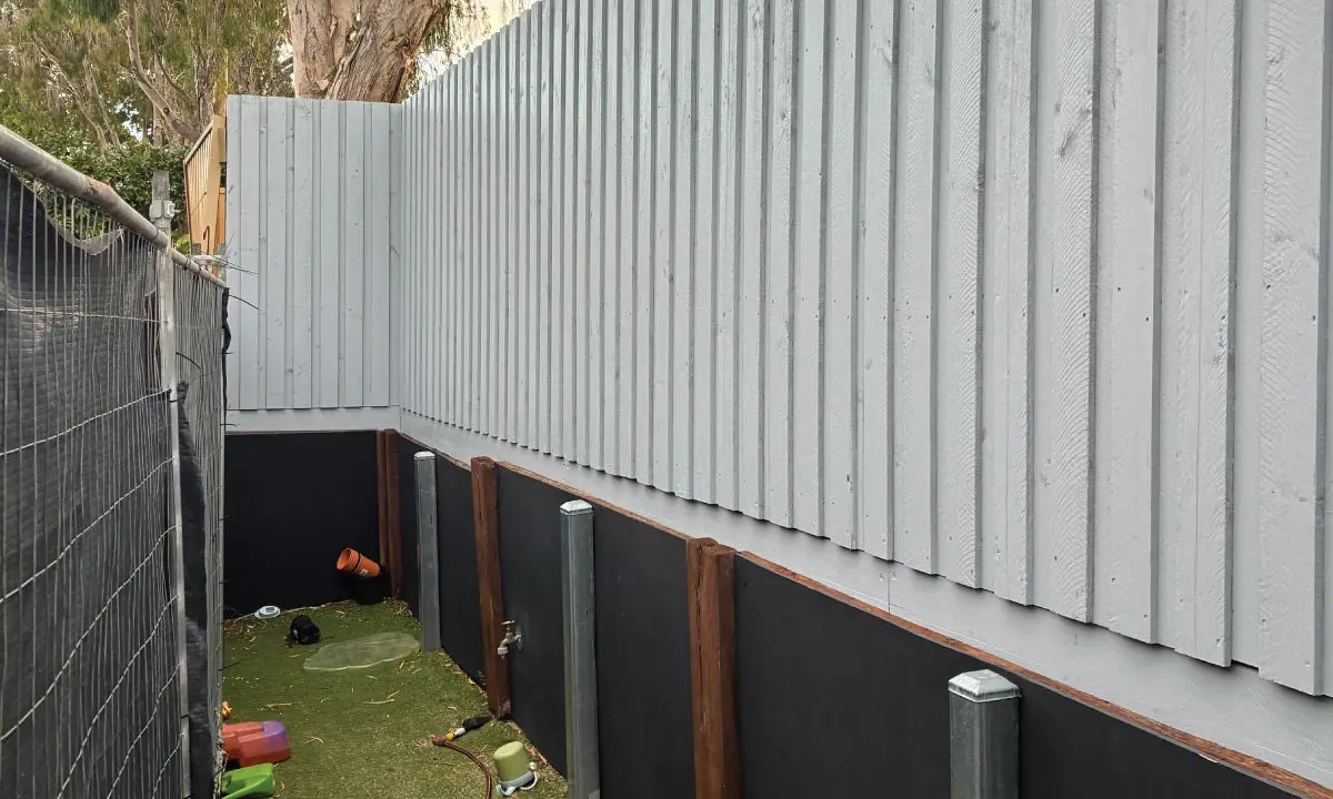 New Colorbond security fence and gate beside synthetic grass, Beak Street childcare centre, Gladstone