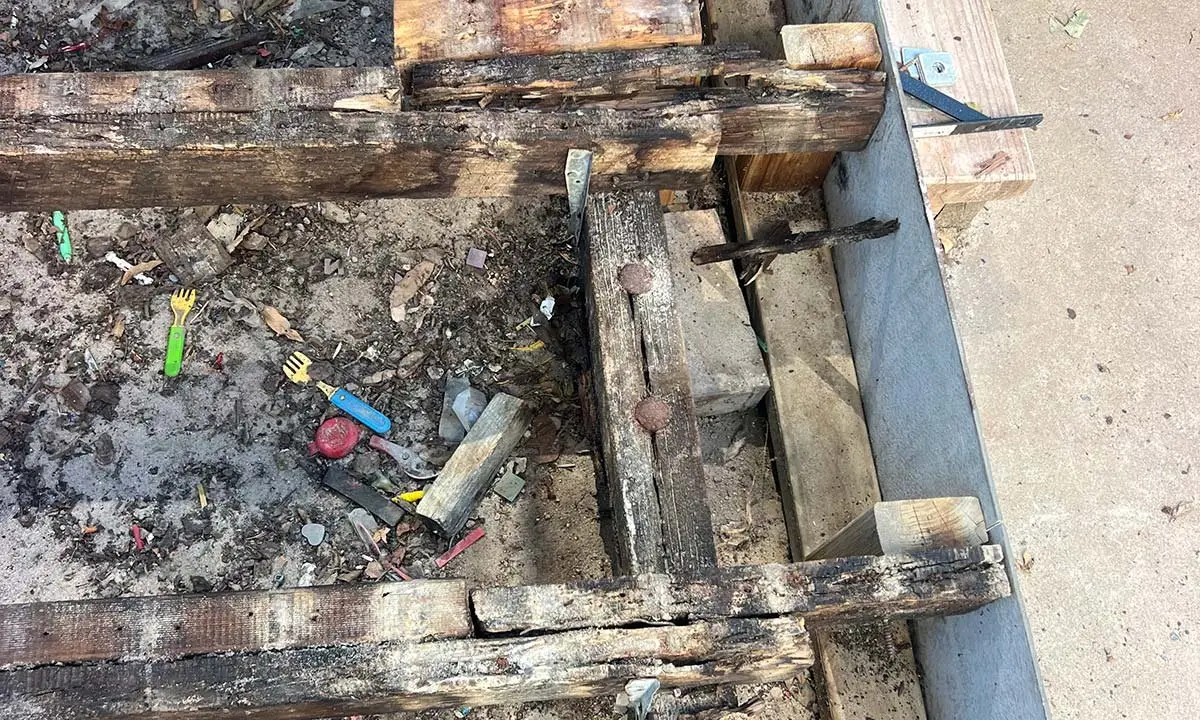 Rotted deck framing exposed before replacement, Warwick