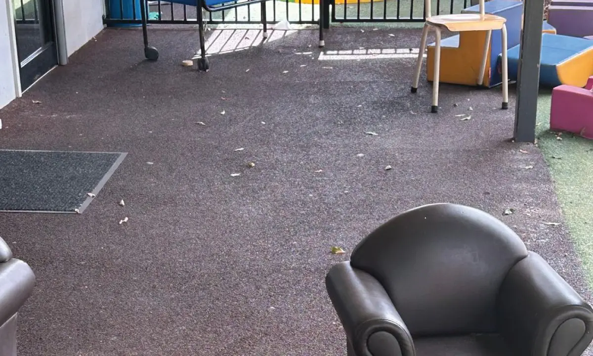 Worn verandah surface with an old armchair before replacement, Booval