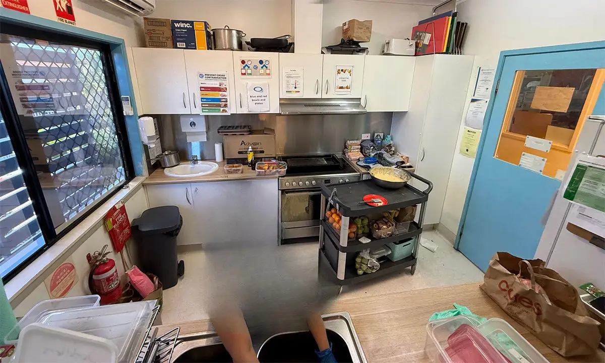 Old kitchen with red laminate cabinets before the upgrade, Nundah