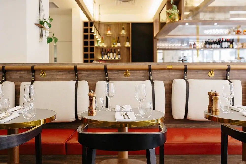 Dining banquette with curtains and timber shelving