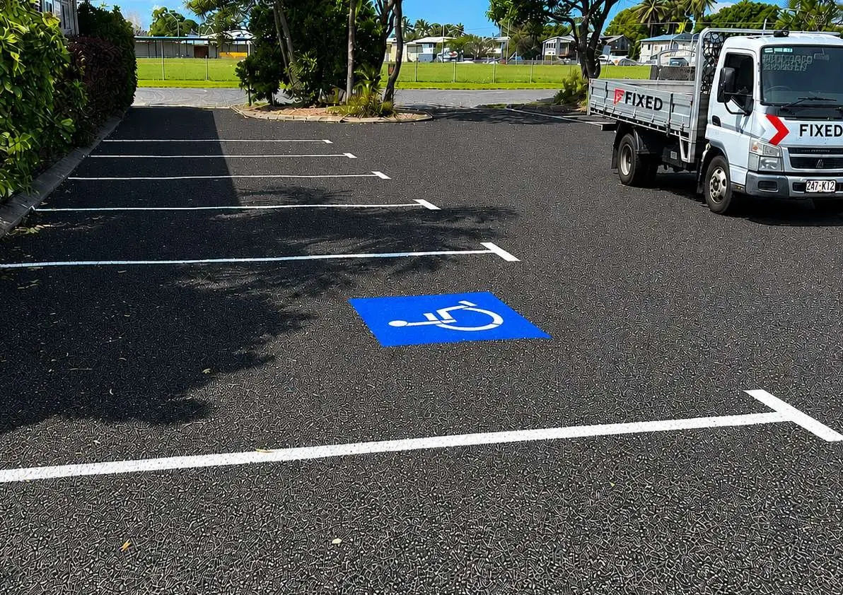 Freshly sealed childcare centre car park with new line marking and the Fixed work truck