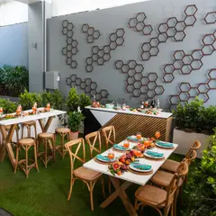 Chelsea Lane at the Mercure Brisbane with lit marquee lettering, hexagon wall art and timber function tables