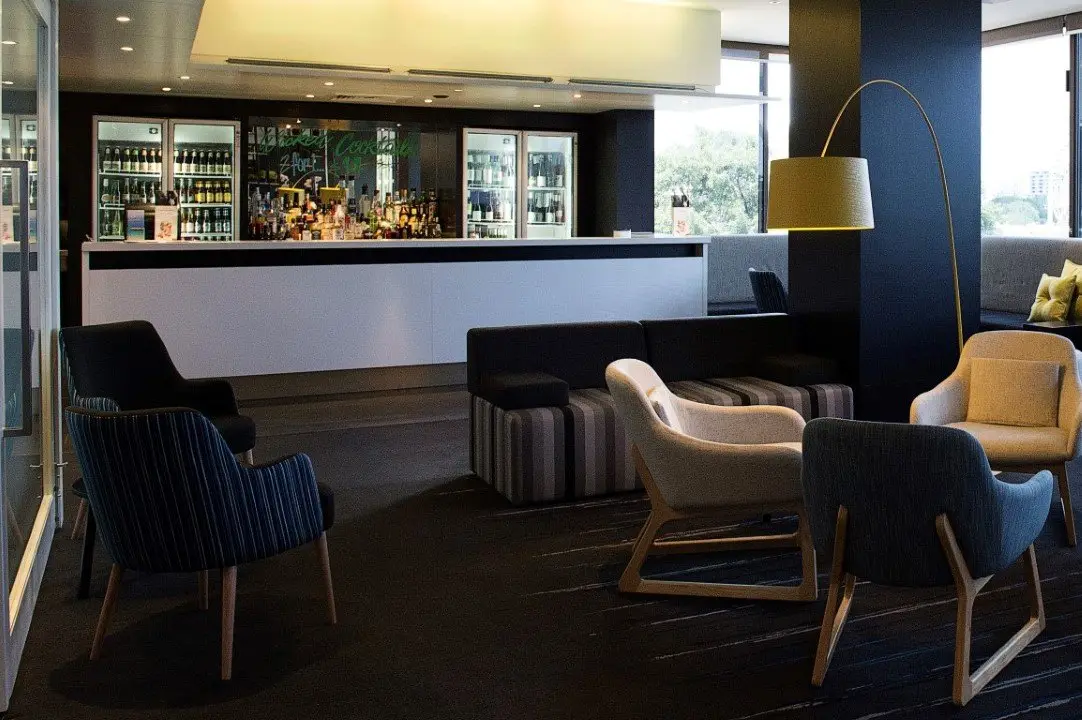Bar with stools and pendant lighting in the refurbished restaurant