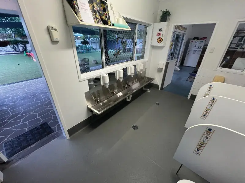 New stainless steel trough and child-height basins under the windows