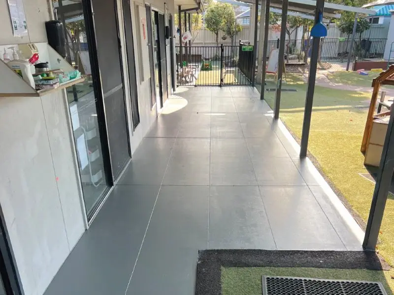 Tiled verandah meeting the synthetic grass yard