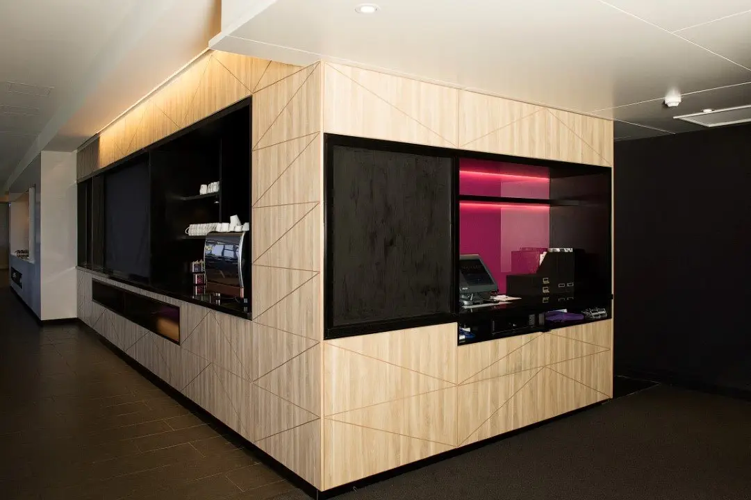 Timber-panelled buffet counter with black feature joinery