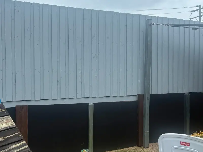 Colorbond fence over the rebuilt retaining wall