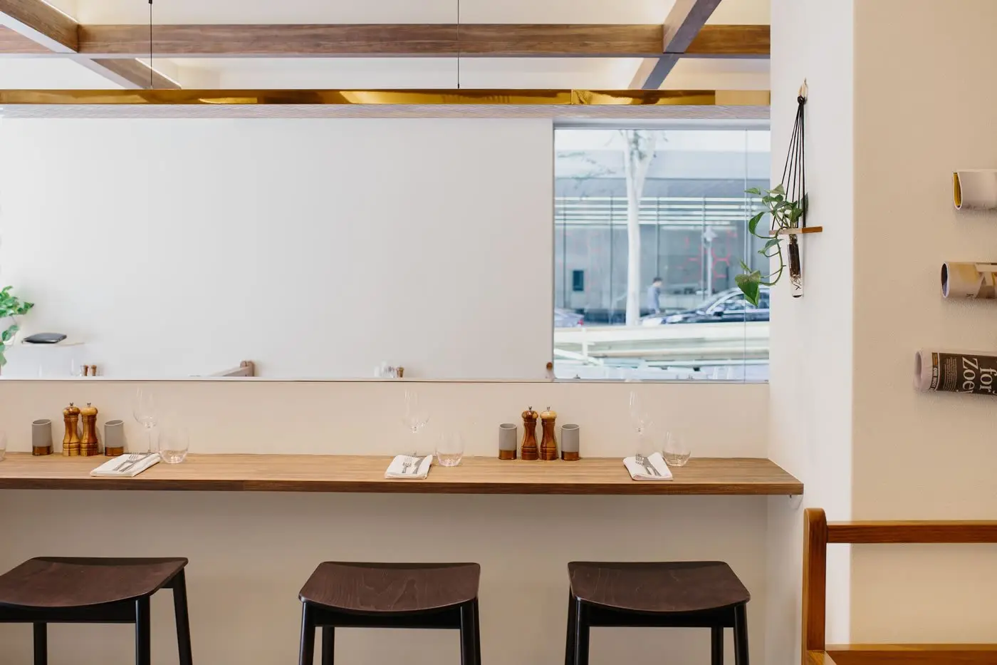 Refurbished Croft House restaurant at The Sebel Brisbane with marble feature wall and timber rafters