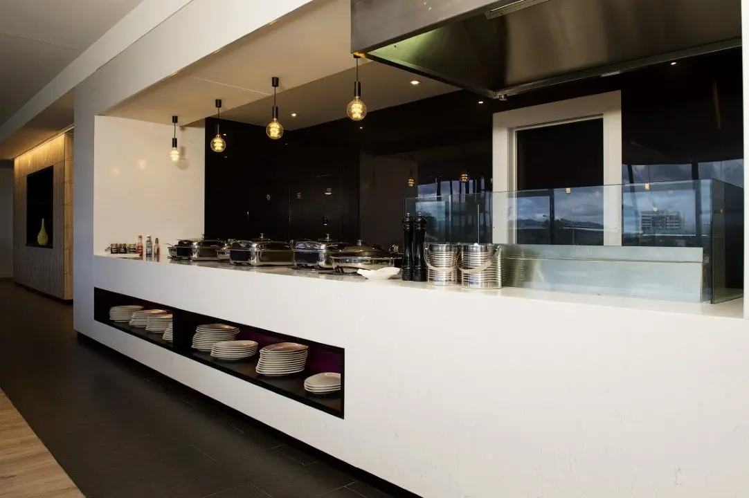 Buffet servery counter with white joinery and timber battens