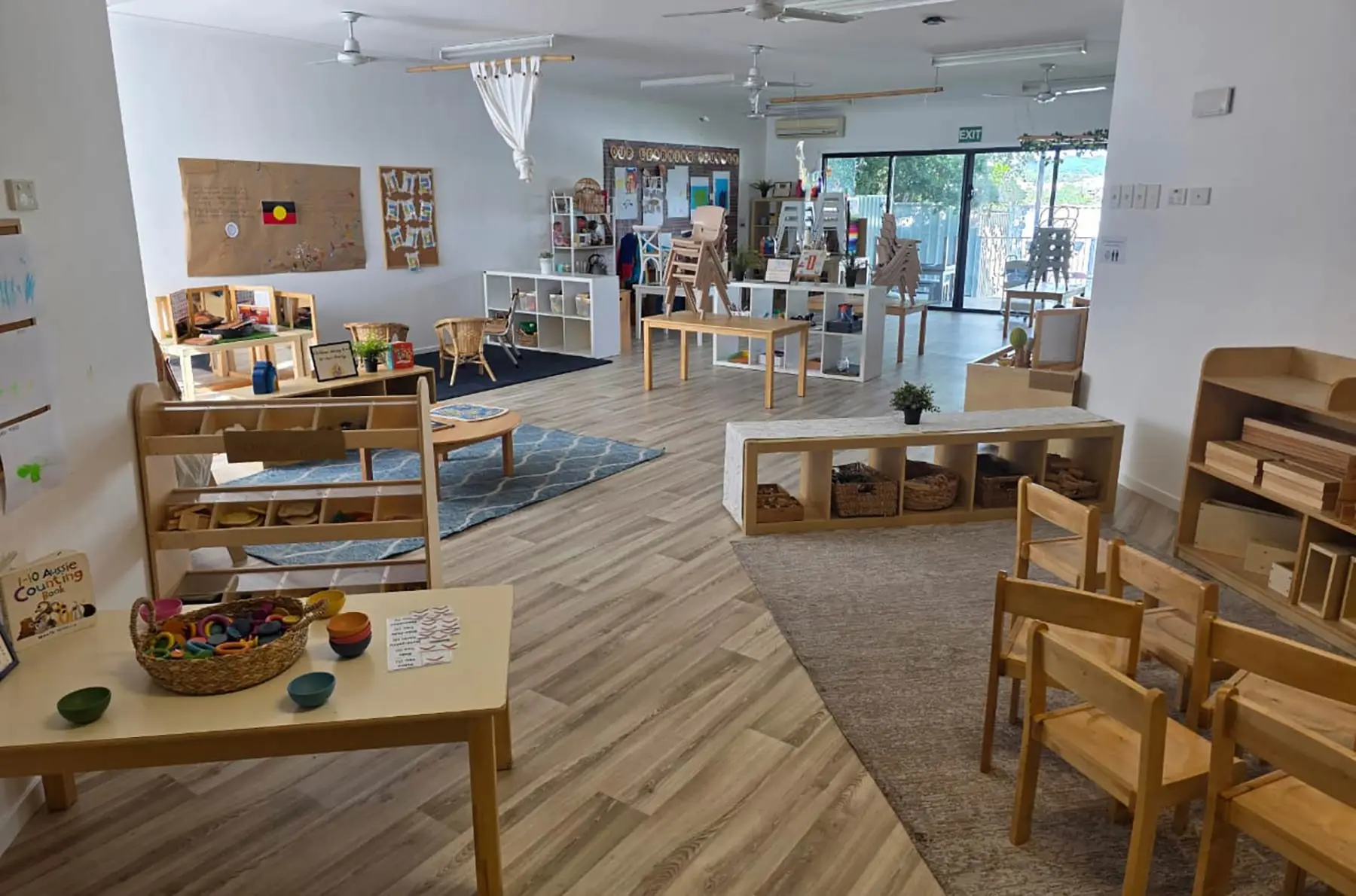 Refurbished childcare playroom with timber furniture and new vinyl plank flooring