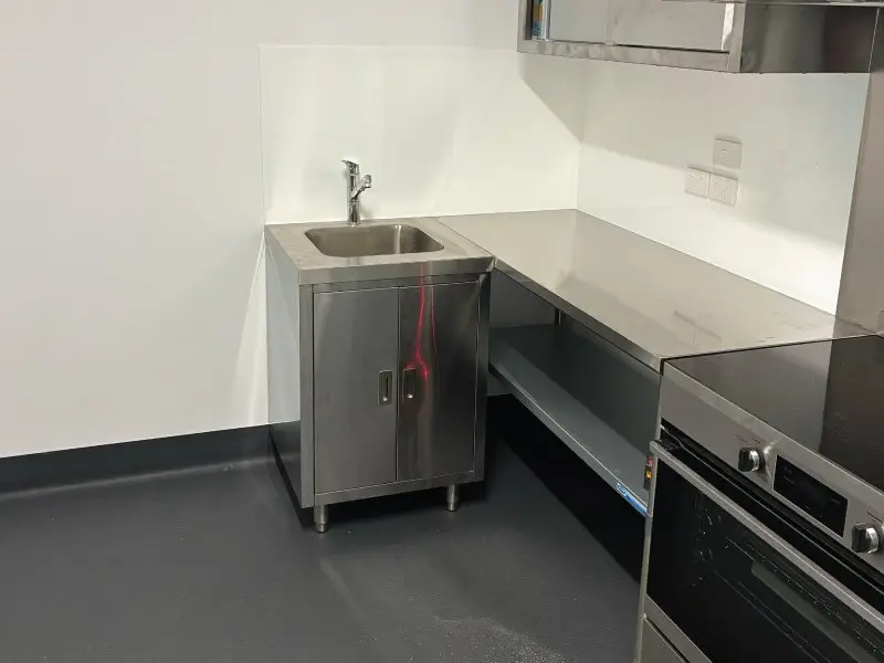 Stainless steel sink and bench run in the new kitchen