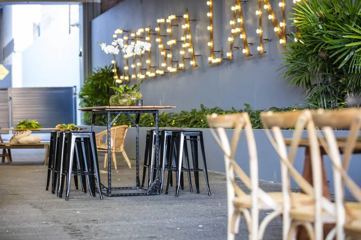 Pallet furniture and planters in Chelsea Lane by day